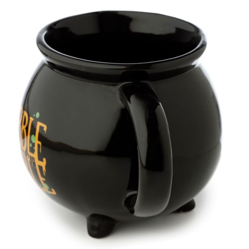 Ceramic cauldron-shaped mug in black, perfect for cozy drinks and whimsical decor. Ideal for themed events and gifting.