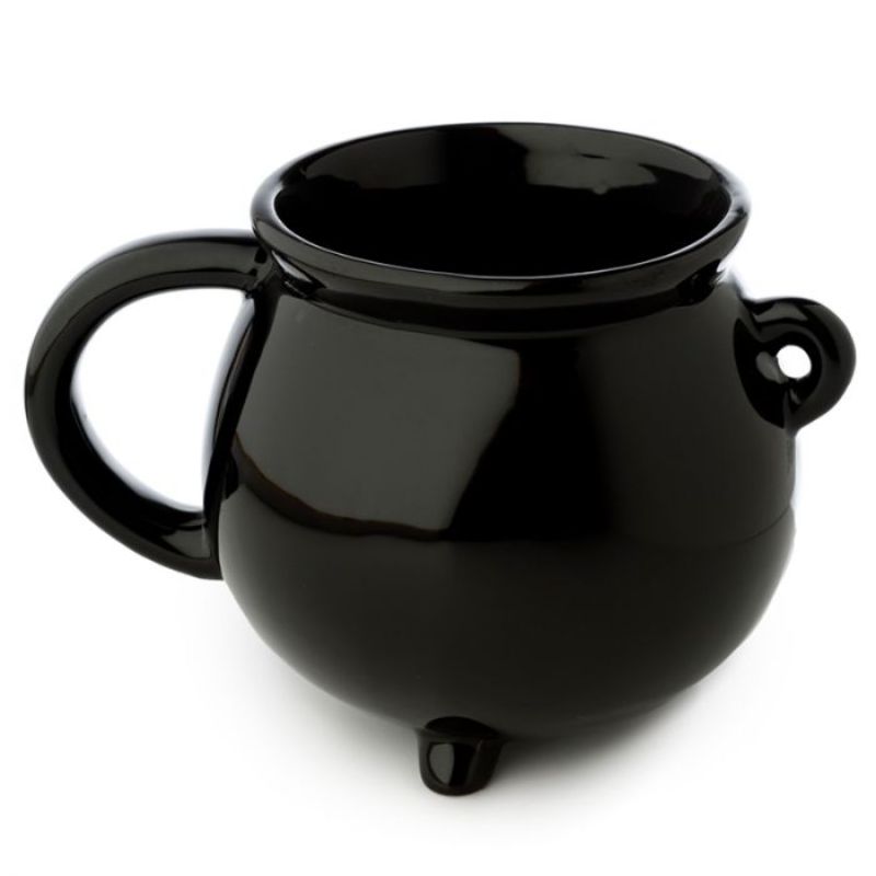 Whimsical black cauldron-shaped ceramic mug for hot beverages, perfect for cozy gatherings and magical moments.