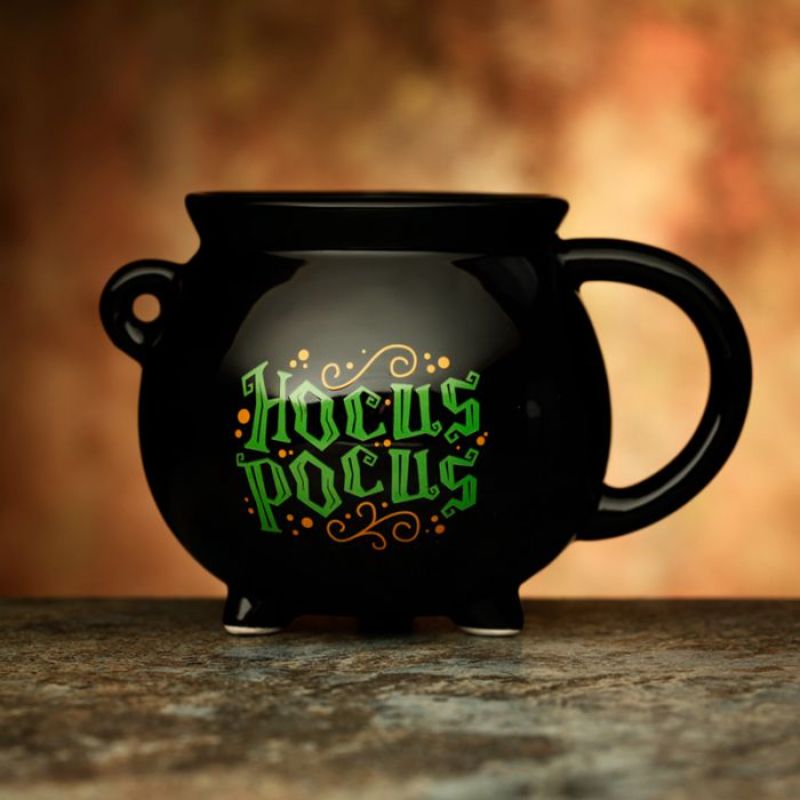 Ceramic shaped mug designed like a black cauldron, perfect for magical sips and Halloween-themed gatherings.