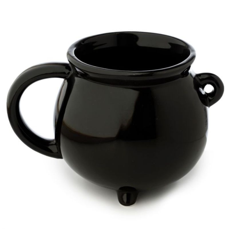 Ceramic black cauldron mug with intricate details, perfect for witches and Halloween enthusiasts.