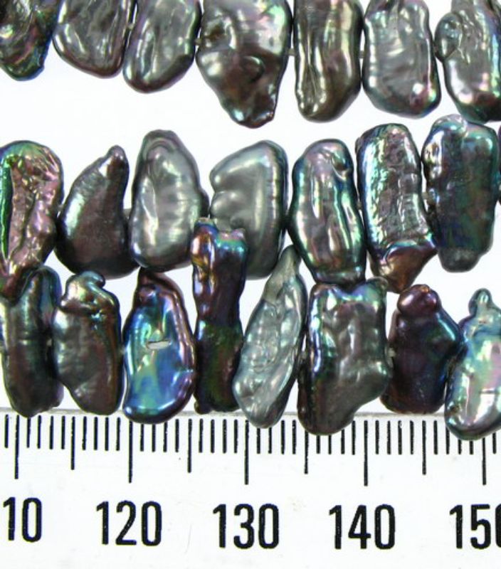 Freshwater black pearl beads, pre-strung on cotton thread, perfect for elegant jewelry designs and crafting projects.
