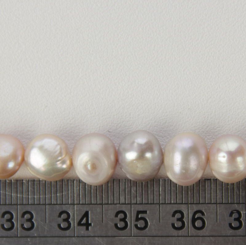 Set of 3 purple freshwater pearls, perfect for elegant jewelry-making and DIY projects with unique luster and charm.