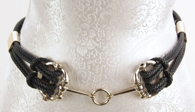Elegant black plait metal belt, perfect for enhancing outfits with its sophisticated design and adjustable fit.
