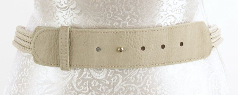 Stylish taupe plaited belt with metal ends, perfect for enhancing any outfit and transitioning from day to night.