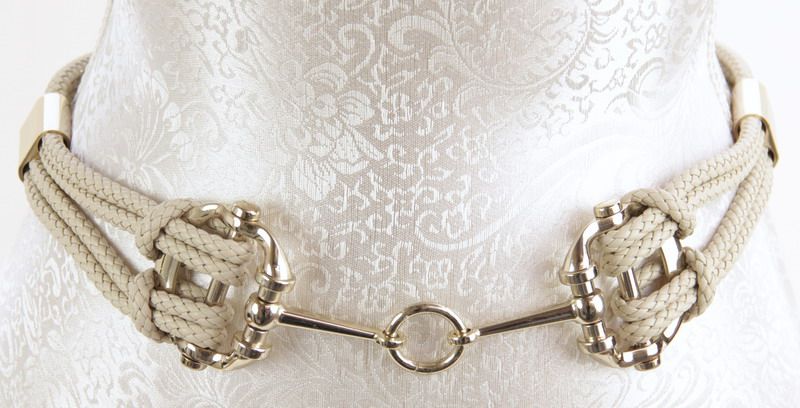 Taupe plaited metal belt, stylish and versatile, perfect for cinching outfits and enhancing contemporary looks.