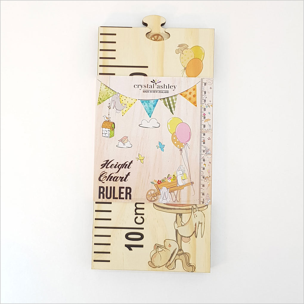 Woodland-themed growth chart ruler in eco-friendly pine, featuring cute animals and customizable puzzle pieces for kids' rooms.
