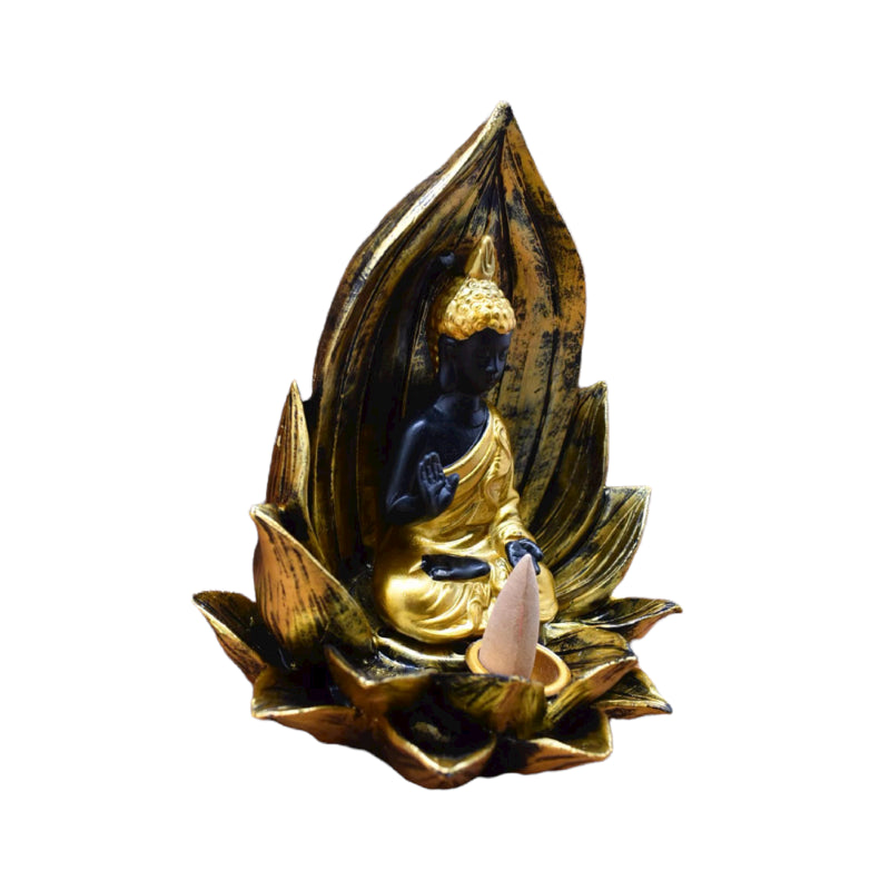 Gold and black Buddha backflow incense burner seated in a lotus, creating cascading smoke for a tranquil atmosphere.