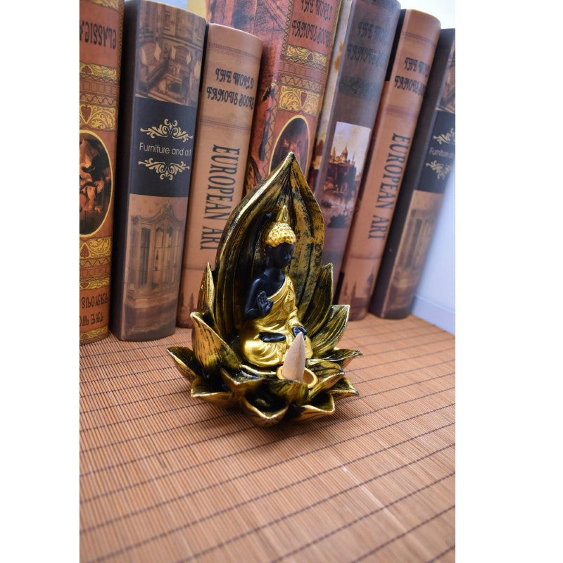 Buddha Backflow Burner in gold and black, featuring a seated Buddha in a lotus, creates serene incense smoke cascades.