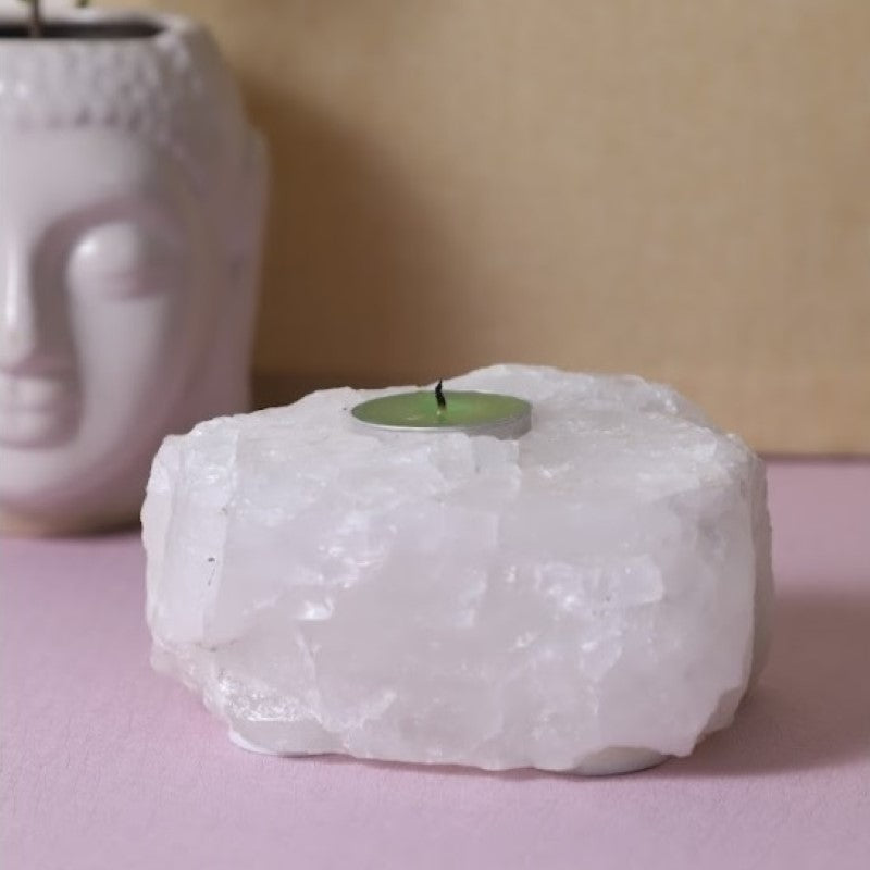 Clear Quartz Tealight Holder showcasing natural elegance, promotes tranquility, holds one standard tealight, unique variations.