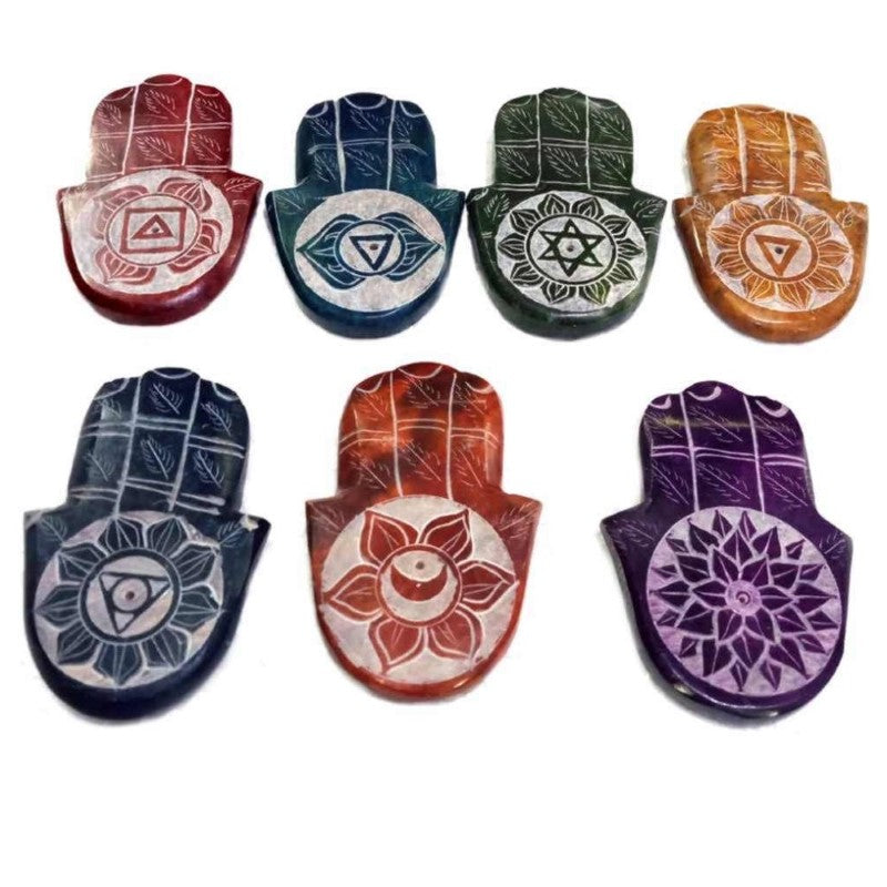 Set of 7 hand-carved soapstone Hamsa incense holders, featuring unique chakra designs for spiritual practice and home decor.