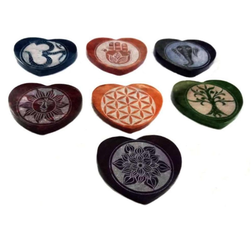 Set of 7 handcrafted heart-shaped soapstone incense holders, each representing a chakra for meditation and relaxation.