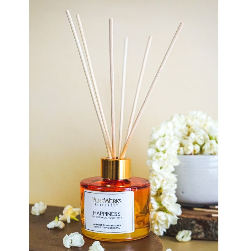 Happiness Jasmine Reed Diffuser in an ombre glass jar with citrine chips, promoting joy and emotional well-being.