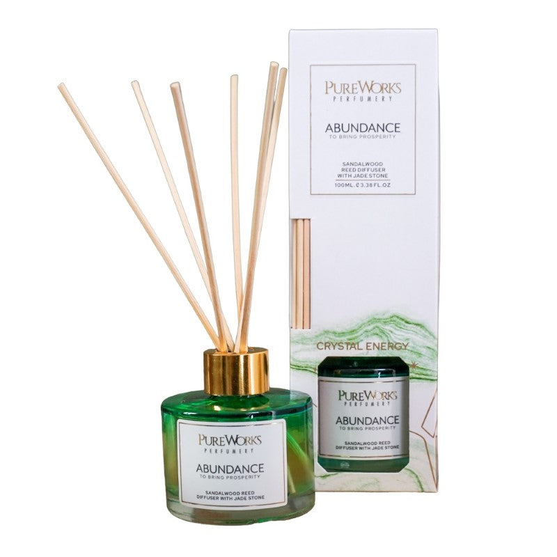 Abundance Sandalwood Reed Diffuser in ombre glass with jade crystal, promoting prosperity and a calming atmosphere.