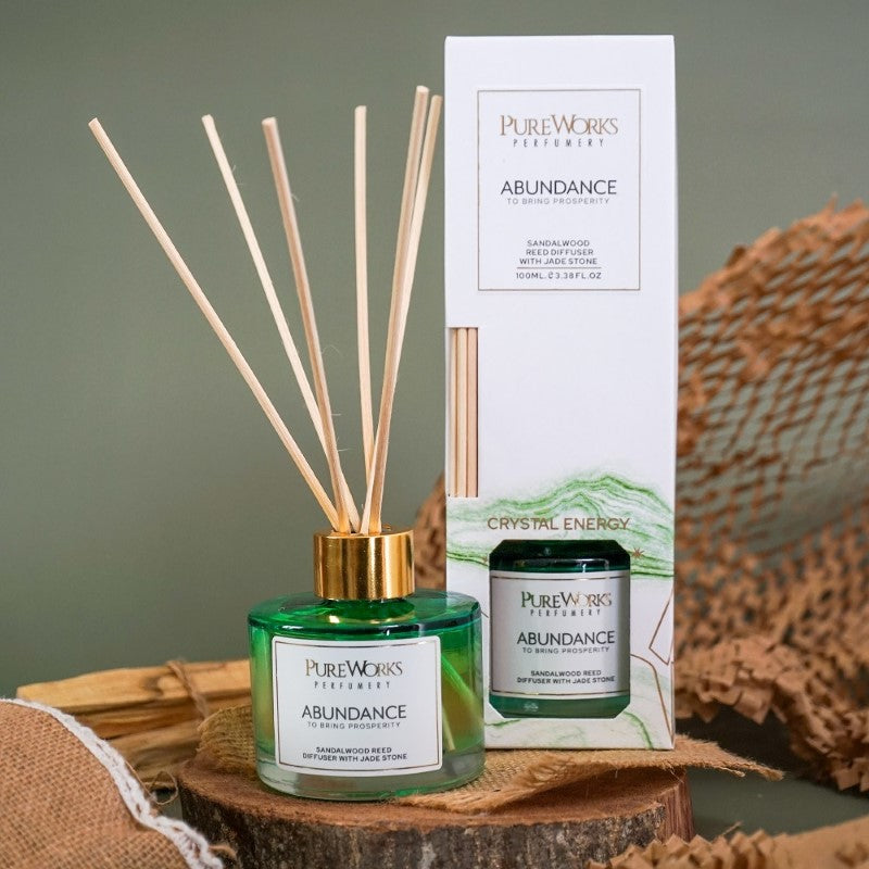 Abundance Sandalwood Reed Diffuser with Jade crystal in elegant ombre jar for calming fragrance and prosperity.