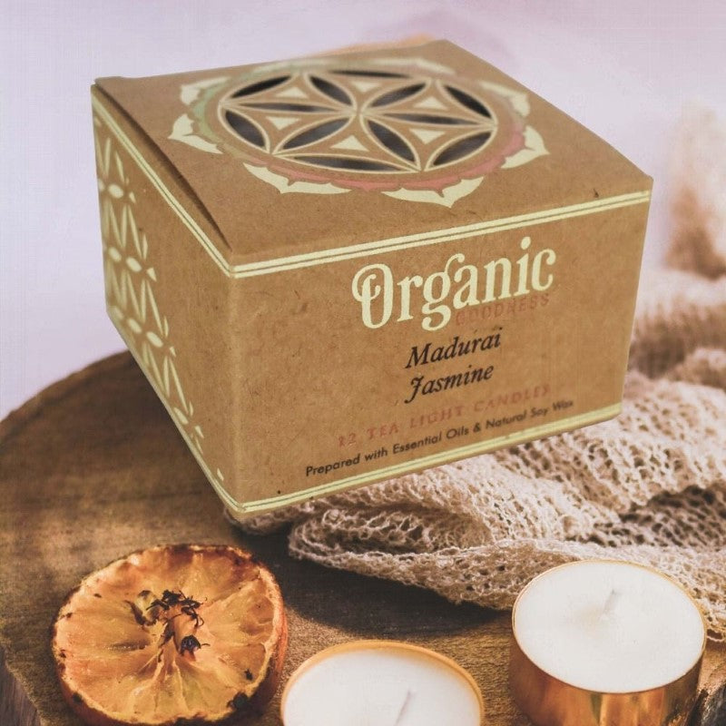 Set of 12 hand-poured jasmine tealight candles in a kraft box, featuring eco-friendly soy wax and lead-free wicks.
