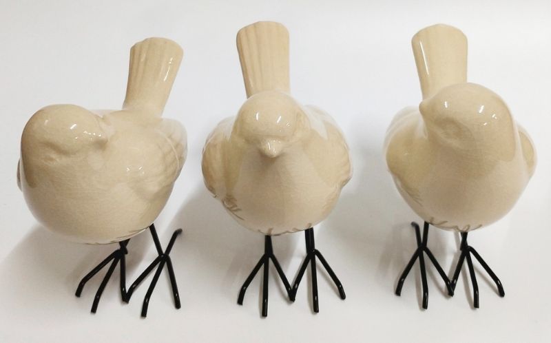 Set of 3 elegant white bird ornaments with turned heads, perfect for enhancing home decor and adding natural charm.