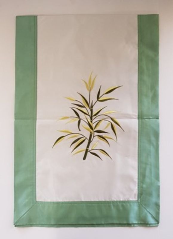 Elegant green and white fabric and silk table runner with bamboo designs, measuring 1.0m x 42cm for stylish dining decor.