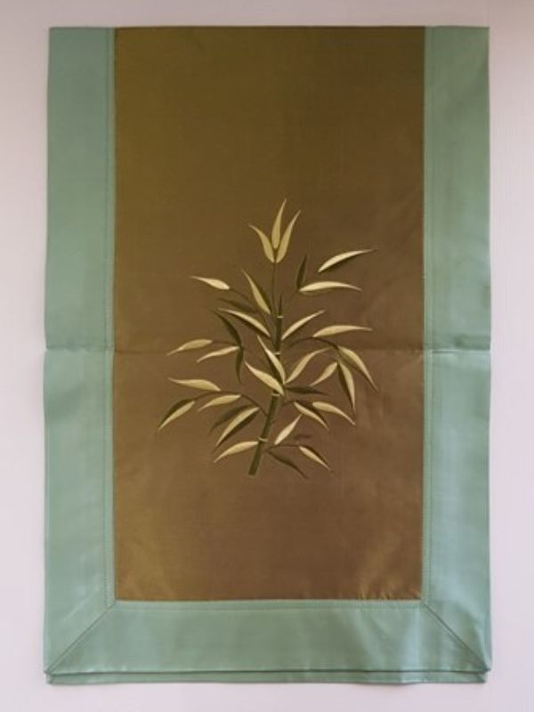 Elegant two-tone green fabric and silk table runner with bamboo designs, measuring 1m long and 42cm wide.
