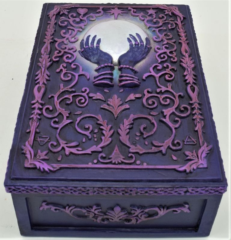 Tarot box featuring hands cradling a purple orb, measuring 14cm, ideal for storing tarot decks and crystals.