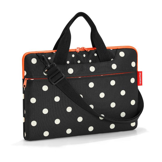Stylish Reisenthel Mixed Dots netbook bag with padded compartment for 15.6" notebooks, external pockets, and adjustable strap.