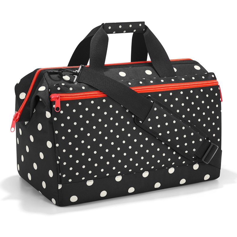 All Rounder L Pocket Bag in mixed dots, featuring a spacious design, sturdy base, and versatile carrying options for travel.