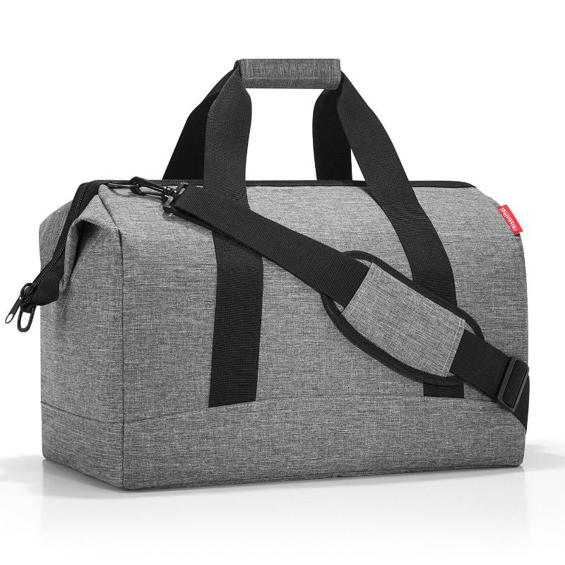 Stylish silver Reisenthel All Rounder L Bag with roomy 30L capacity, padded straps, and six inside pockets for organized travel.