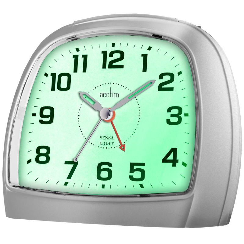 Sleek silver alarm clock with non-ticking sweep hand and Sensa-Light for easy nighttime time-checking.