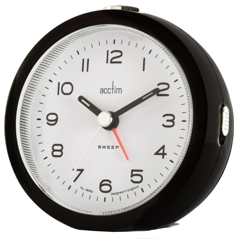 Sleek raven black alarm clock with luminous hands, non-ticking sweep, and snooze function for peaceful sleep.