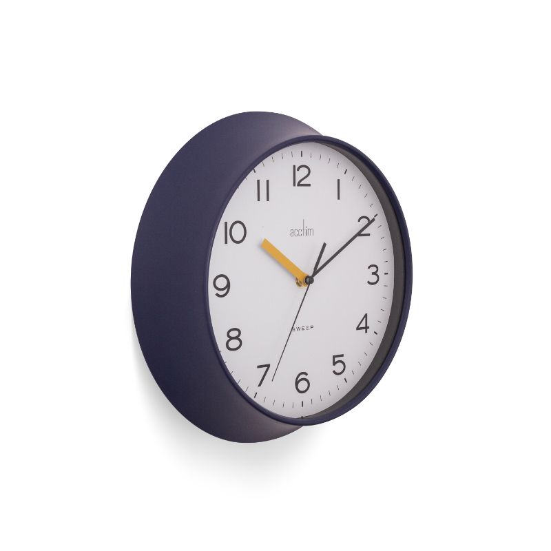 Midnight blue wall clock with bold numbers; vintage style meets modern design, perfect for any room decor.