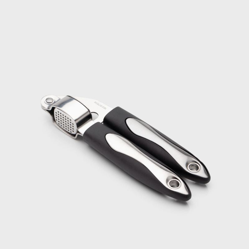 Taylors Garlic Press: Effortlessly crush unpeeled garlic cloves, made from durable stainless steel for easy use and cleaning.