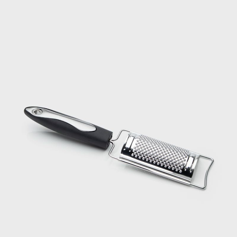 Compact 14cm stainless steel grater and zester with ergonomic handle for easy use and storage, perfect for fresh flavors.