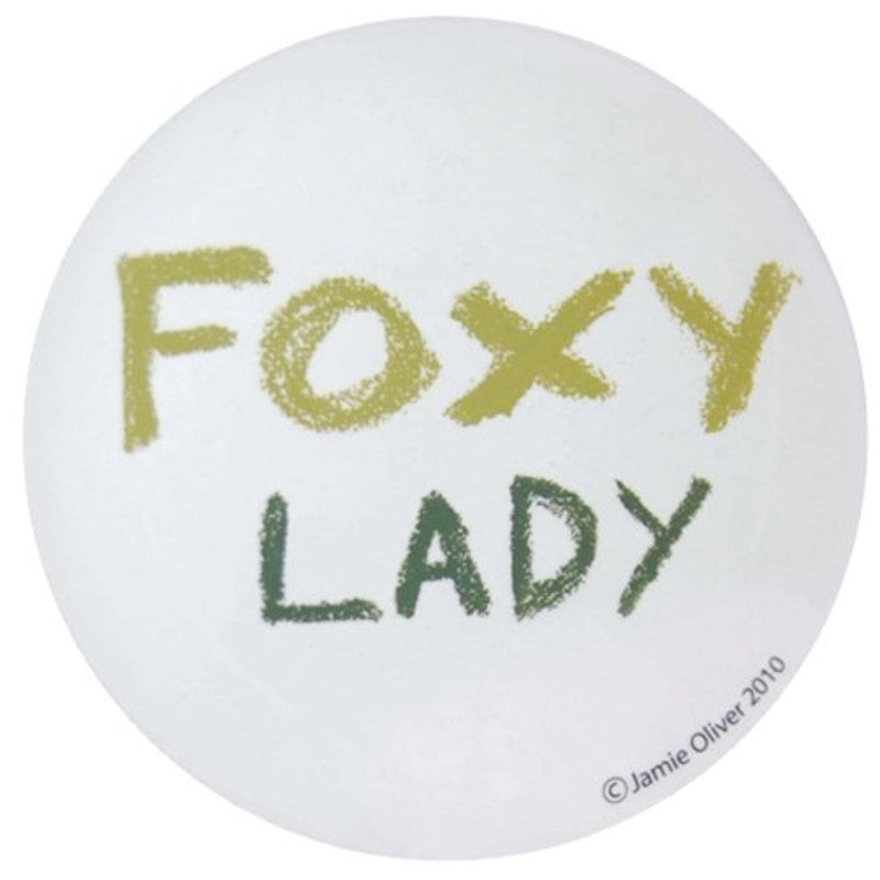 Cheeky round coaster featuring Jamie Oliver's Foxy Lady design, heat-resistant and cork-backed, perfect for stylish decor.