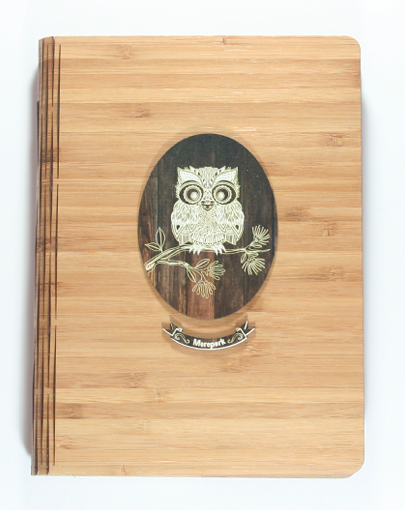Dark wood bamboo journal with tribal husky pattern, FSC certified, perfect for gifting or personal use.