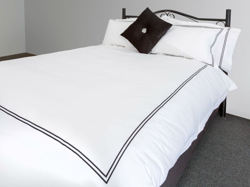 Elegant black queen duvet cover set featuring a Double Festoon design, includes a duvet cover and two matching pillowcases.