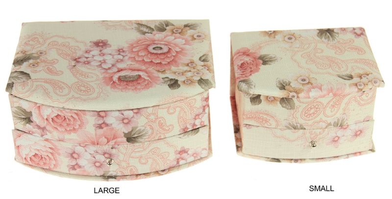 Elegant small jewellery box with a curved front, featuring compartments for rings, necklaces, and earrings.