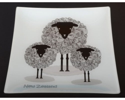 Ornamental glass plate featuring a cute sheep design, ideal for decor or gifting, celebrating New Zealand's sheep culture.
