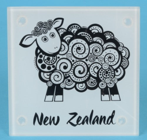 Coaster set with four tempered glass coasters featuring unique Koru sheep designs, perfect for home decor and gifting.