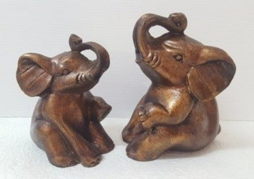 Resin sitting elephant figurine, 14cm, adding elegance and whimsy to decor, symbolizing wisdom and strength.