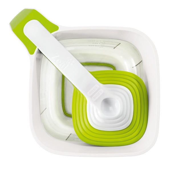 Vibrant green 9-piece measuring cup and spoons set with non-slip base for precise cooking and baking.