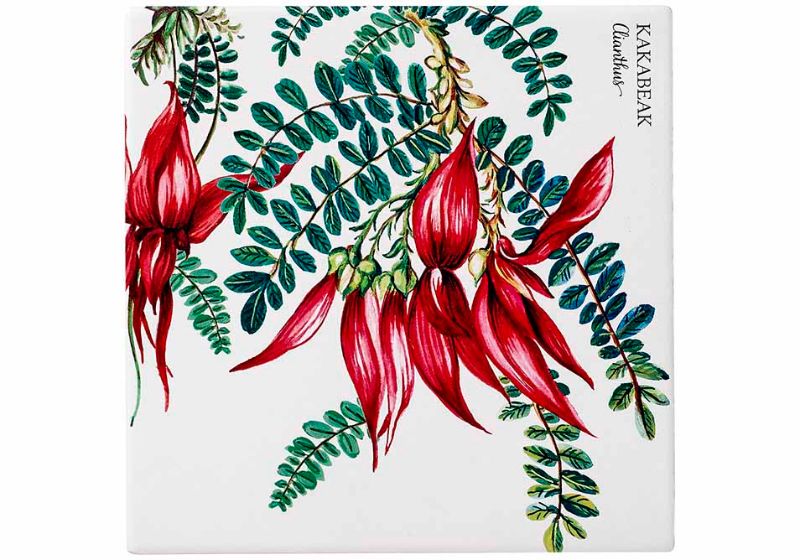 Elegant trivet set featuring Kakabeak flower design, protecting countertops while adding nature-inspired decor.