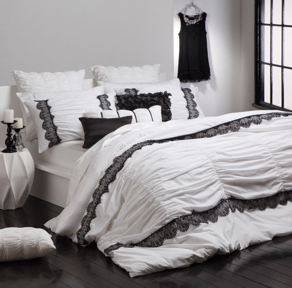 Lara White Long Cushion by Logan and Mason: elegant, plush decorative cushion perfect for enhancing any space's style and comfort.