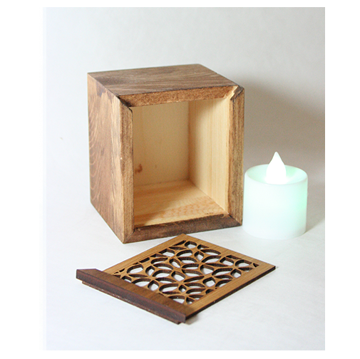 LED tealight box made of laser-cut bamboo with a color-changing LED candle, ideal for gifting and storing trinkets.