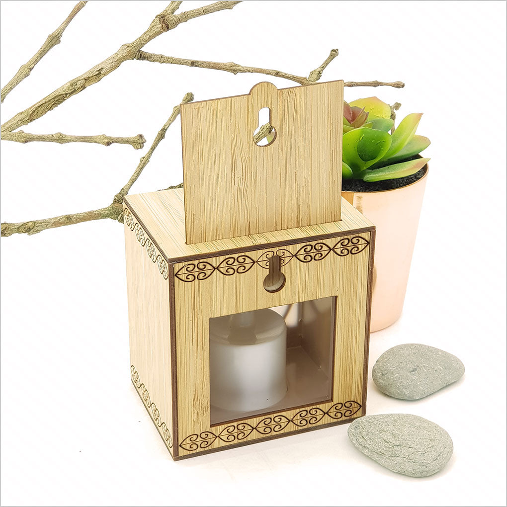 Koru LED tealight candle box in bamboo showcases a beautiful design and color-changing candle for a cozy ambiance.