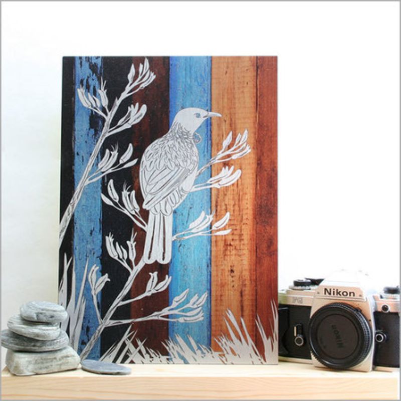 Stunning wall art featuring a Tui on aged timber, printed on ACM Brushed Silver; measures 205mm x 288mm.