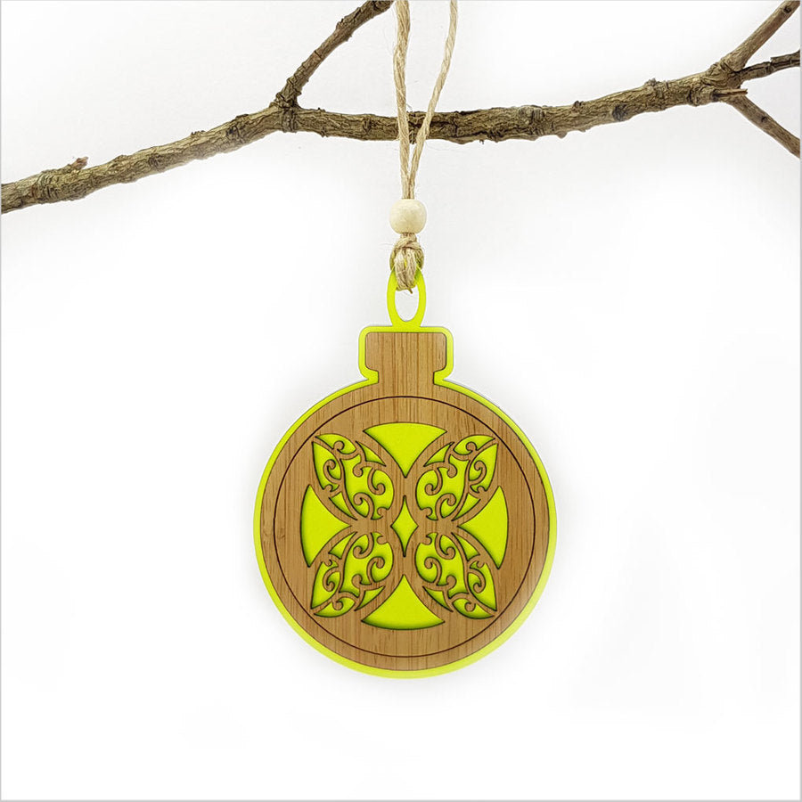 Lime green acrylic bauble ornament featuring a laser-cut flower design, perfect for modern home decor or gifting.