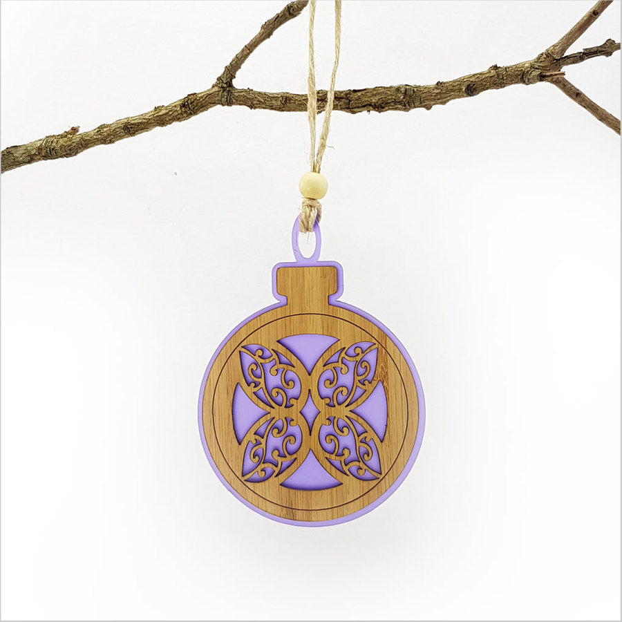 Elegant purple satin acrylic bauble with laser-cut flower design, perfect for holiday and home decoration.