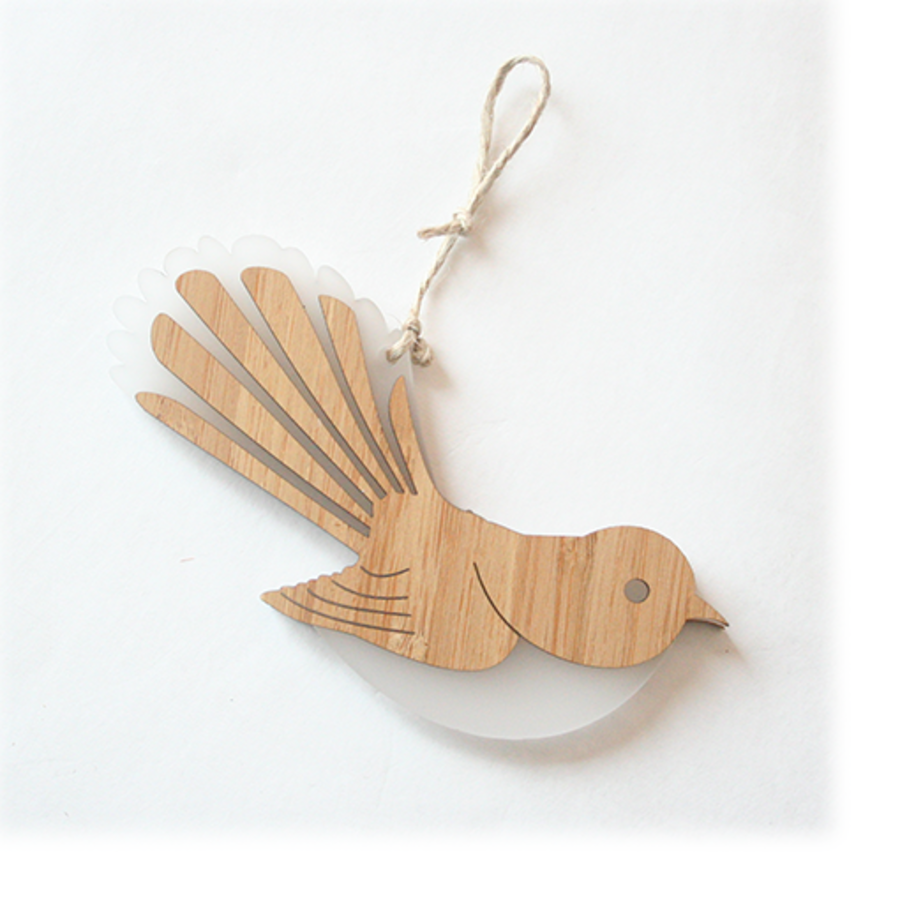 Hanging ornament featuring a laser-cut fantail design in bamboo and white satin acrylic, stylish and eco-friendly.