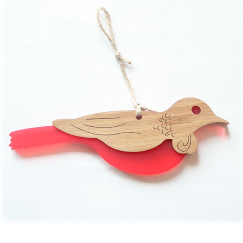 Tui hanging ornament made of bamboo and red satin acrylic, showcasing New Zealand's wildlife in a stylish design.