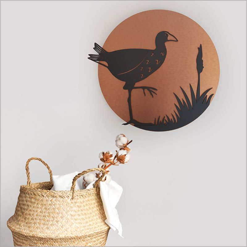 Brushed copper circle wall art featuring a Pukeko design, perfect for indoor or outdoor decor, 37cm in diameter.