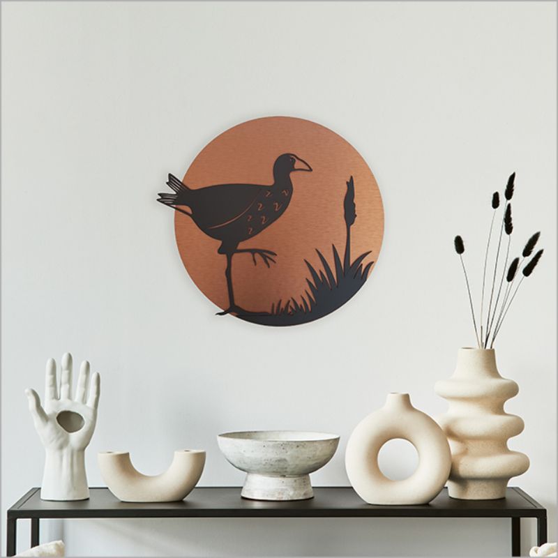 Brushed copper circle wall art featuring an elegant Pukeko design, ideal for indoor or outdoor use, includes mounting block.